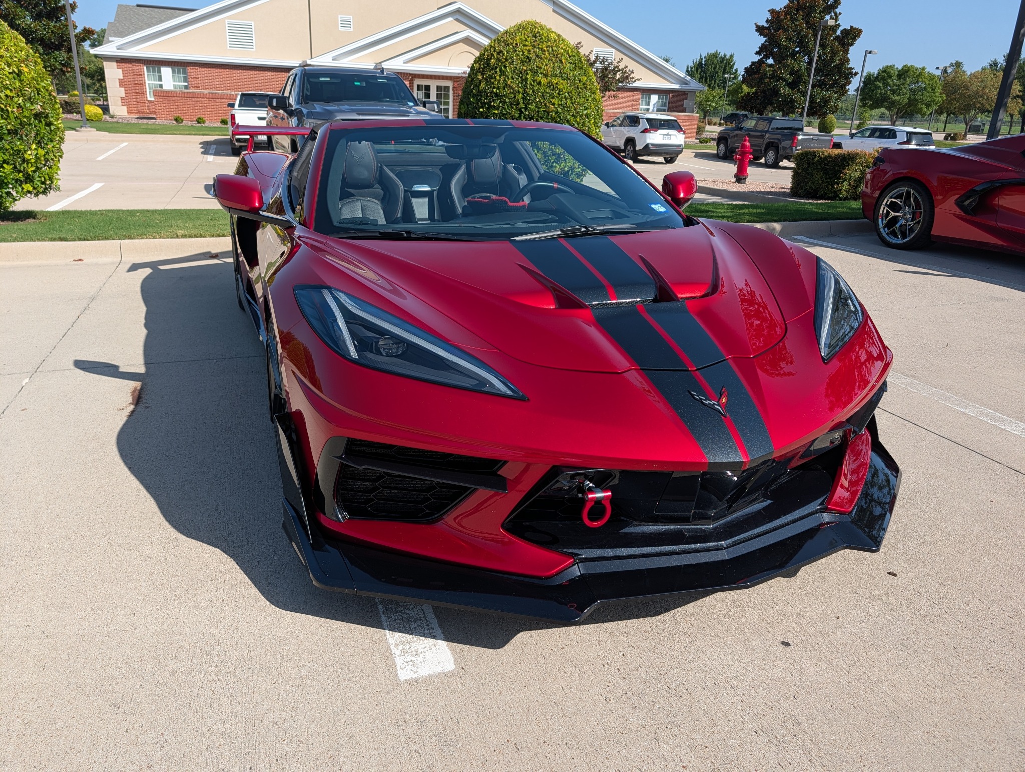 Red Corvette at a group gathering