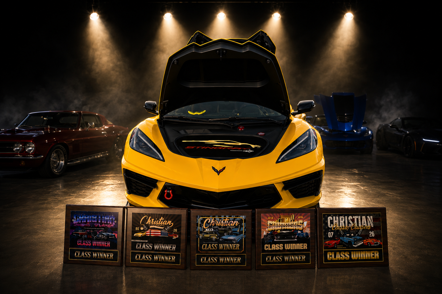 Yellow Corvette with awards under show lights